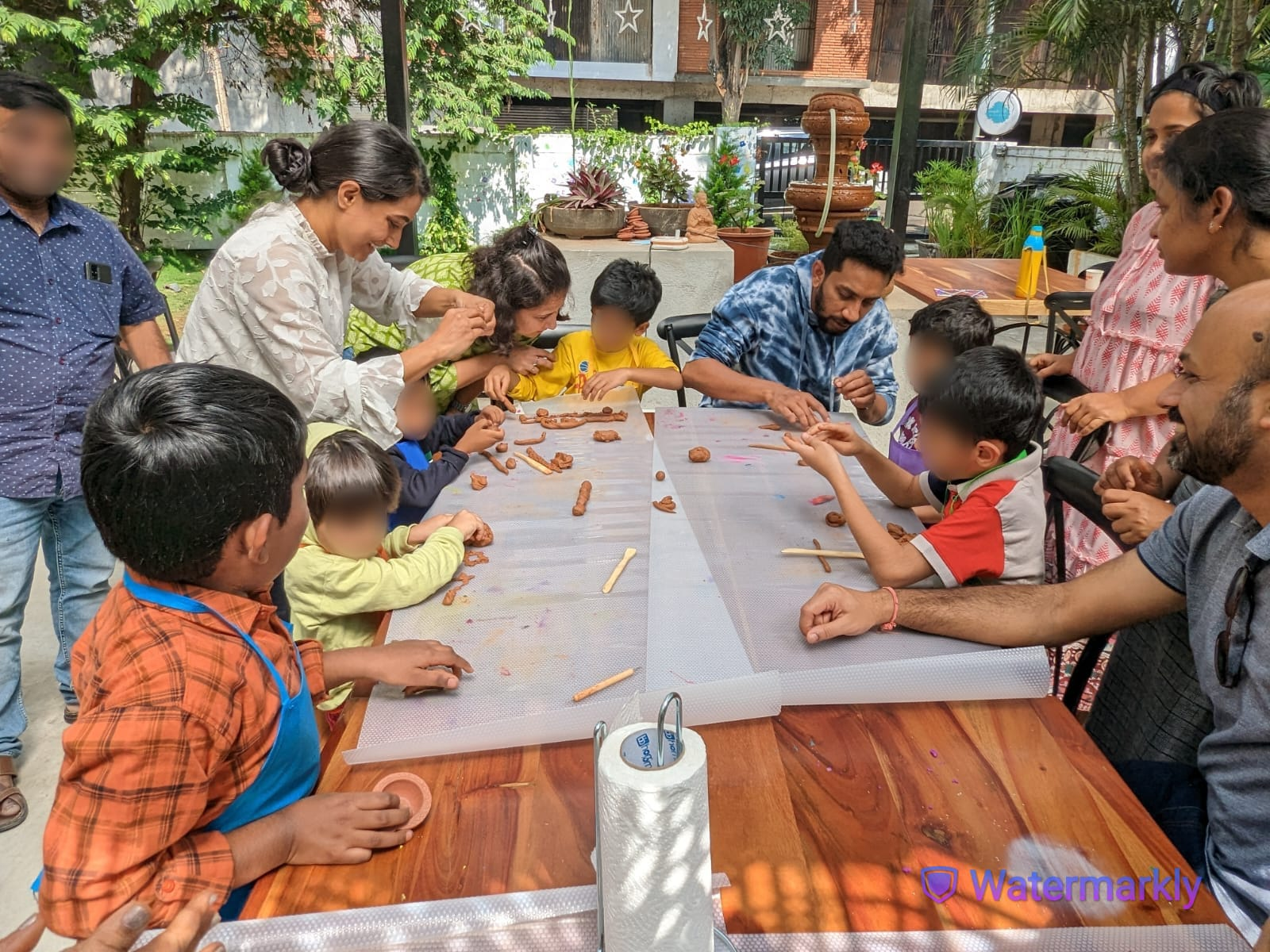 Dr. Preethi Shankar working with two young children in a therapy session.